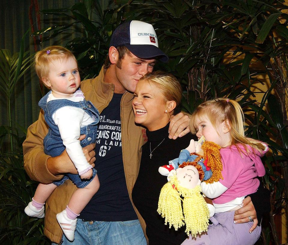  The couple with their daughters, one-year-old Lilly and Mollie, aged two, back in 2004