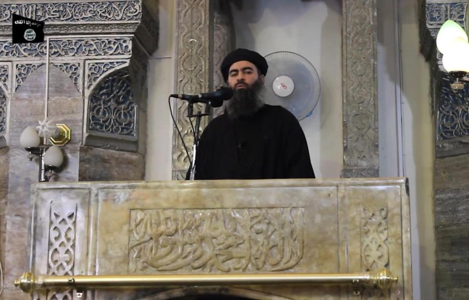  The terror thug pictured making his first public appearance at a mosque in Mosul in 2014