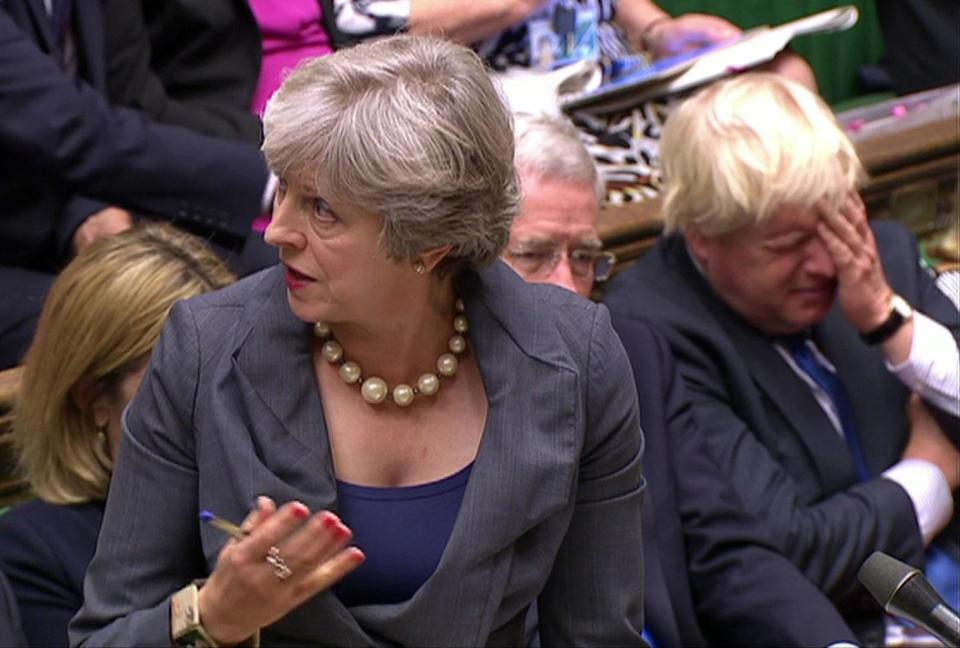  Boris Johnson looking unhappy as Conservative Party rival Theresa May speaks in Parliament