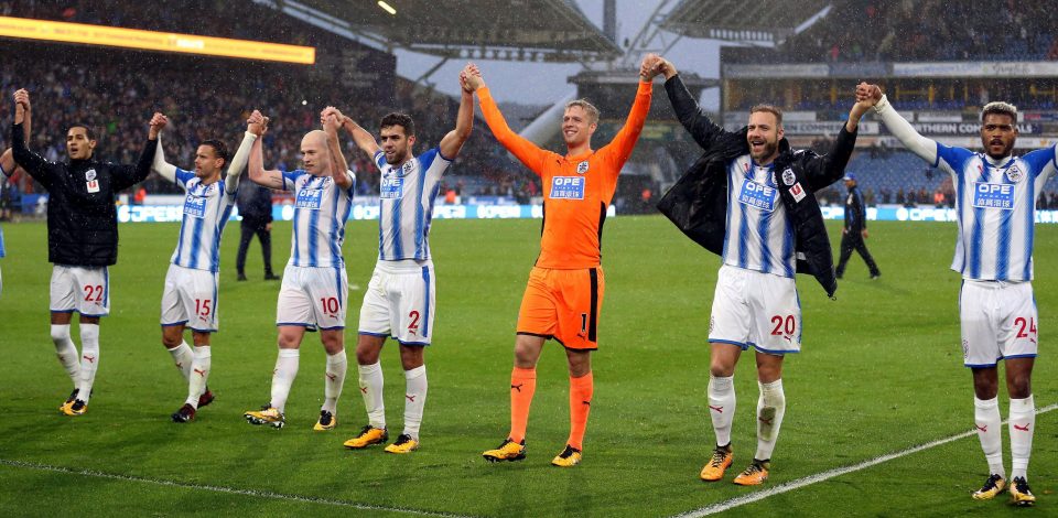  Triumpant Huddersfield Town salute their home crowd after their historic win over Manchester United in October