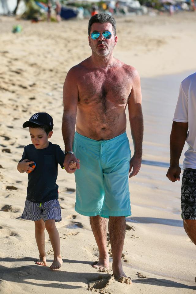  Eric walks hand-in-hand with music mogul dad Simon Cowell