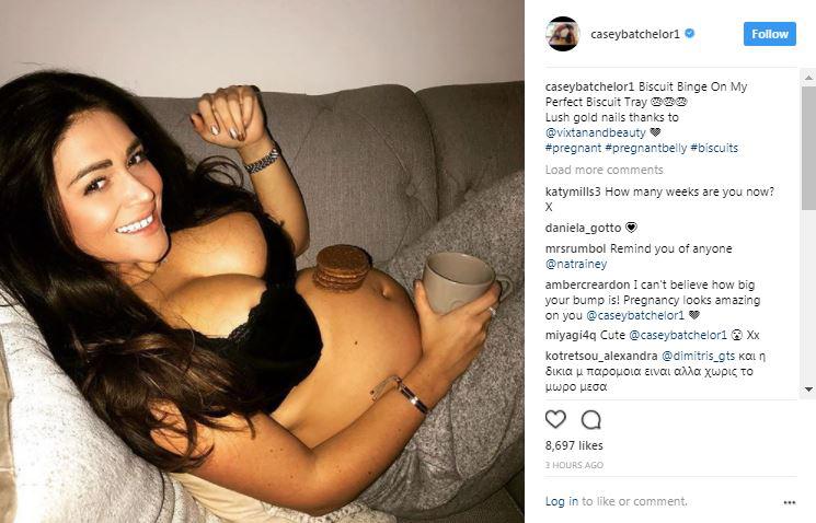  She's been posting regularly on Instagram, sharing this adorable picture of her balancing biscuits on her bump