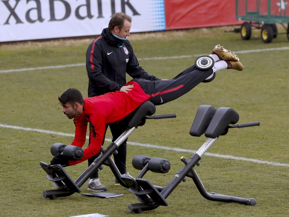  Costa is put through a stretching regime ahead of the game