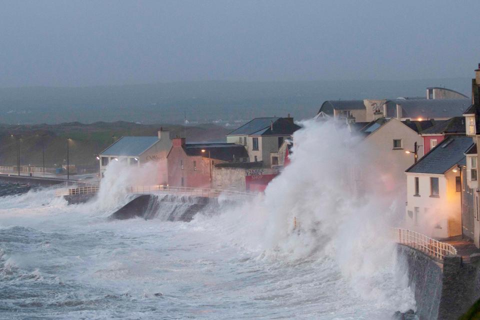  Raging waves batter the seafront in Lahinch, County Clare, yesterday evening as Storm Eleanor headed across Ireland towards Britain