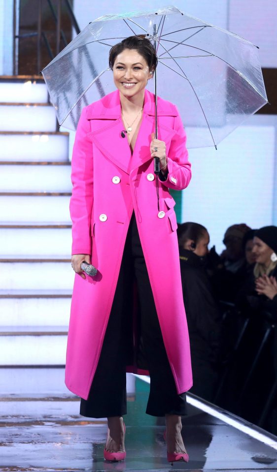  Emma was lauded by the fashion pack for choosing this MSGM hot pink coat for this series' launch night