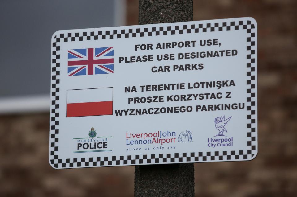  A sign tells motorists to use designated car parks but locals say many people leave their cars in the street for free