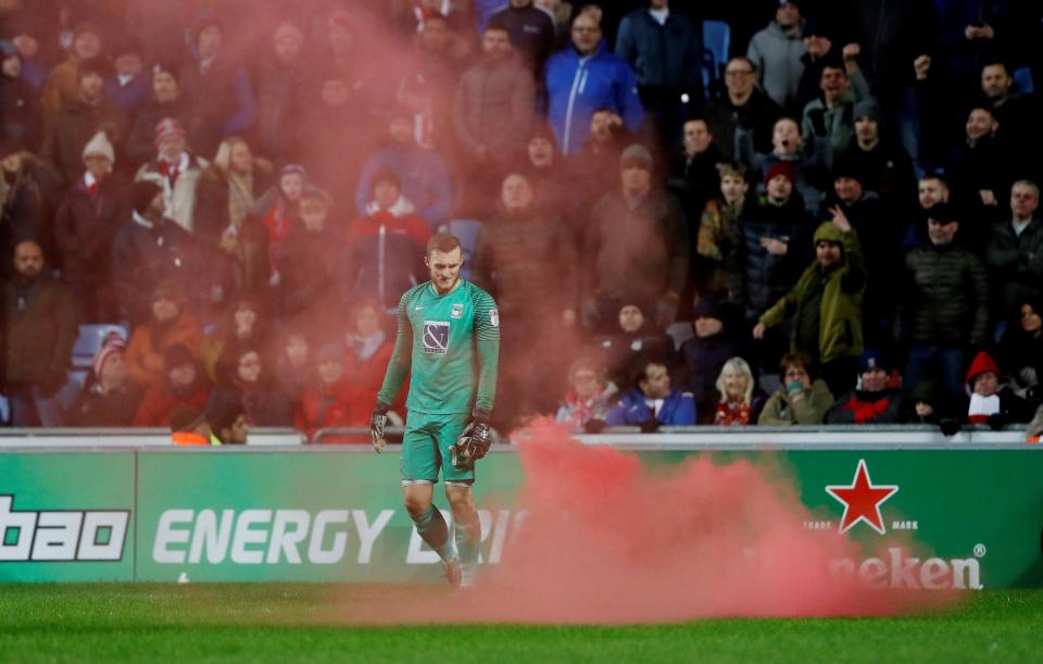  A red flare was thrown onto the pitch to interrupt the game at the Ricoh Arena