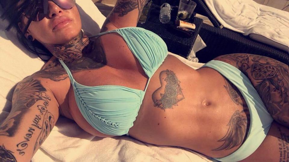  The tattooed beauty was quick to flaunt her fab figure as she topped up her tan