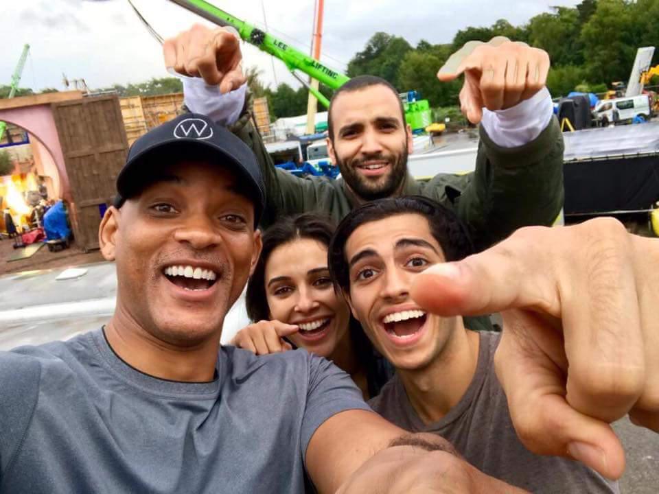  The live action remake of Aladdin has been blasted for darkening white extras skin. The film stars Will Smith, left, as Genie with Naomi Scott, centre, as Jasmine, Mena Massoud, right, as Aladdin and Marwan Kenzari as Jafar