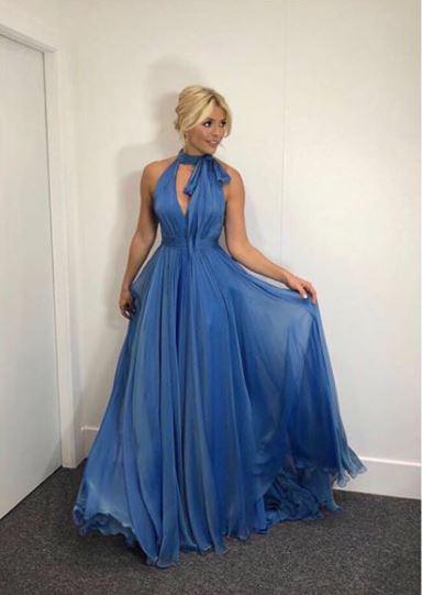  Her outfit for the premiere was a glamorous blue gown