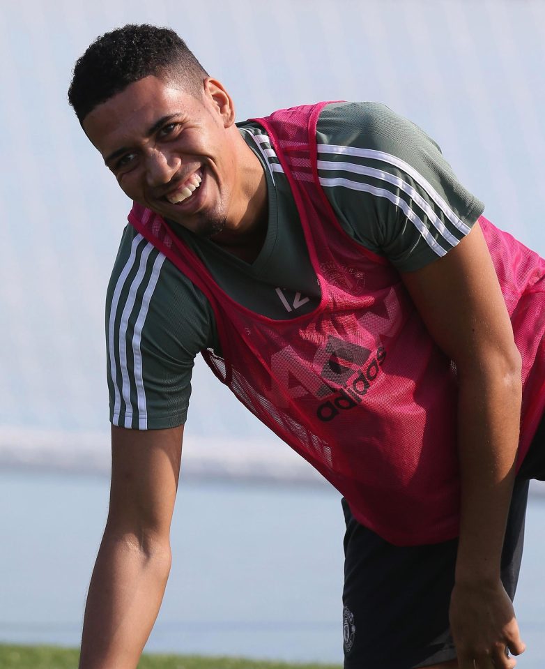  Defender Chris Smalling cracks a smile as United enjoy their time in the sunshine