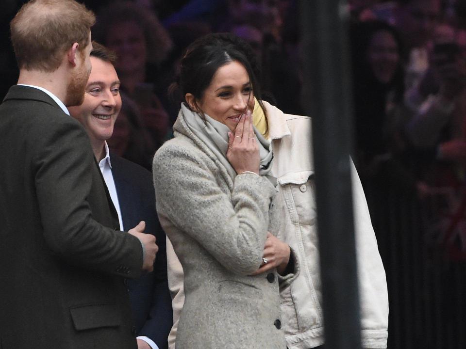  Meghan smiled as she was greeted by eager fans