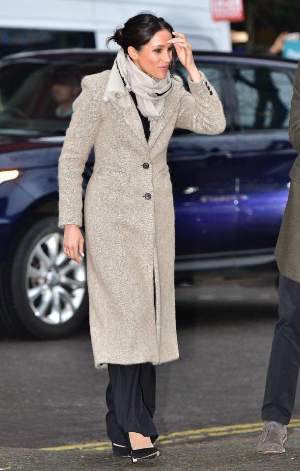  Meghan was bundled up in a grey coat for the visit