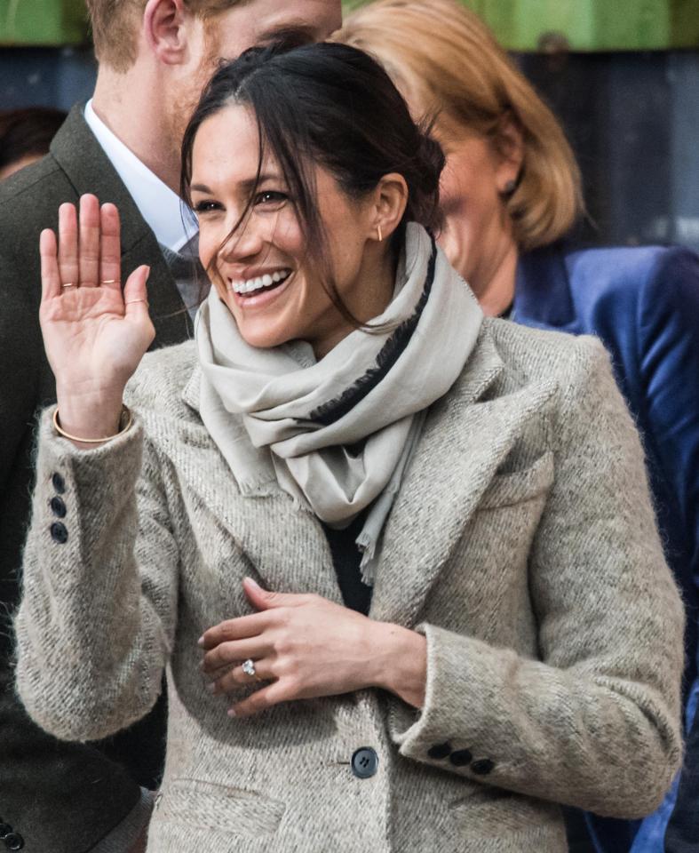  Meghan practises her royal wave for crowds