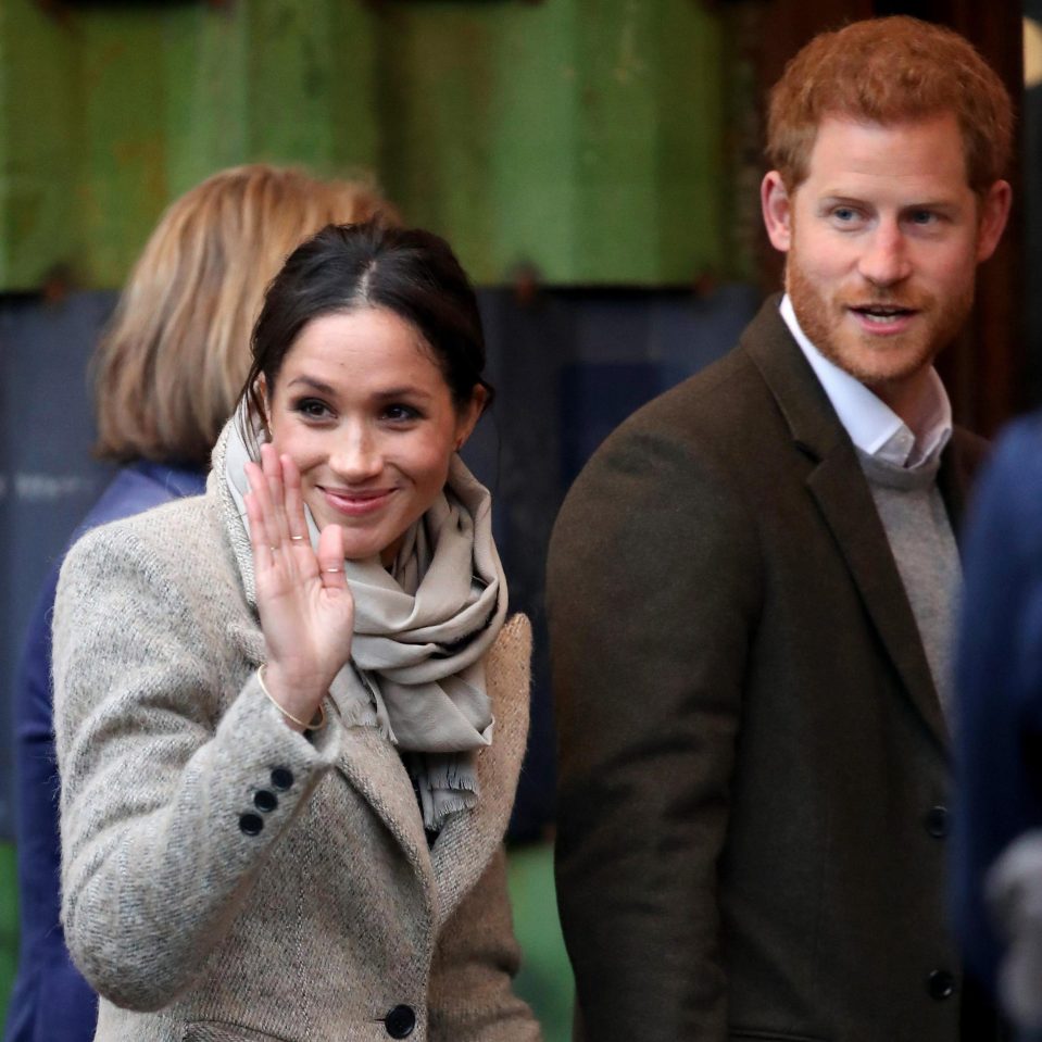  Meghan smiles at her fans on the visit to Brixton