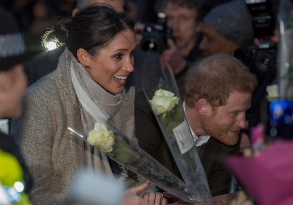  Meghan appeared to be delighted with the gift of flowers from fans