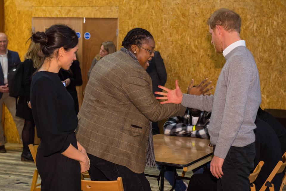  Prince Harry tries out a handshake with radio DJ Remi Aderemi