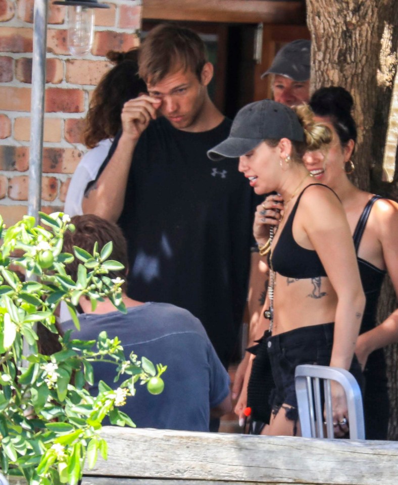 Miley looked happy and relaxed as she ate with Liam's family and friends