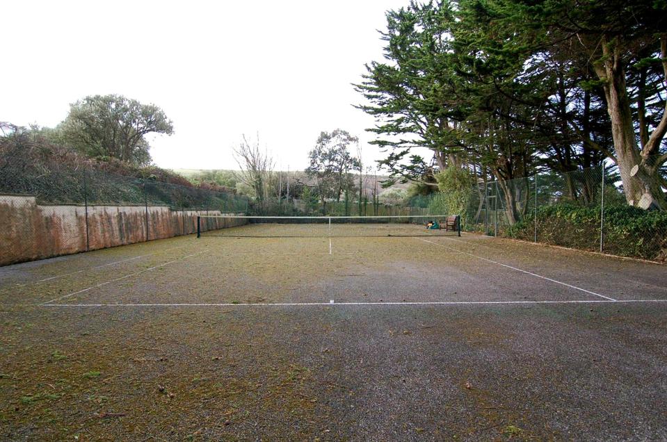  The stunning home comes complete with its own tennis court too