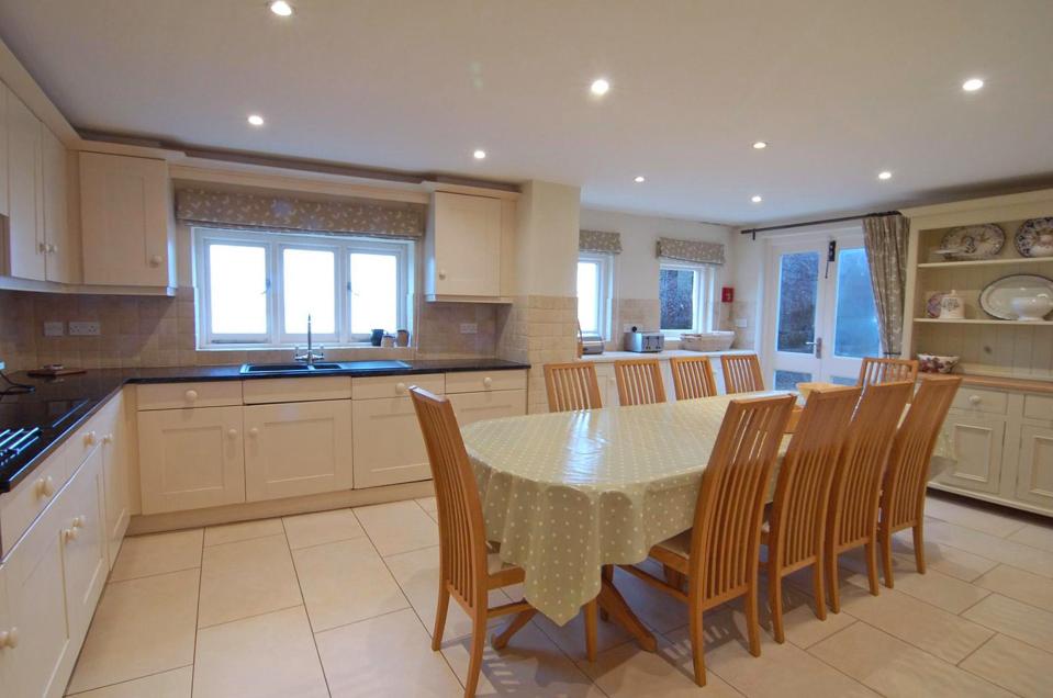  The country-style kitchen is impressive in size and offers uninterrupted views of the sea