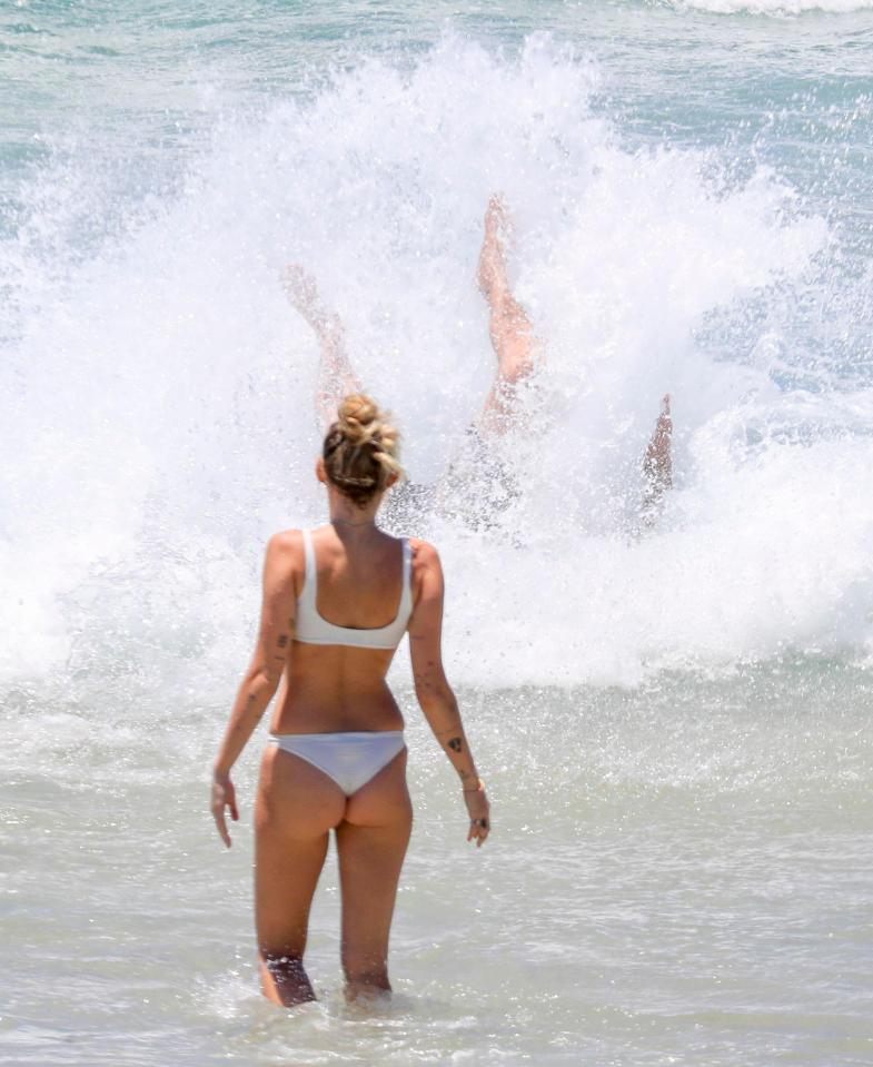  The couple looked to be having a great time in the surf