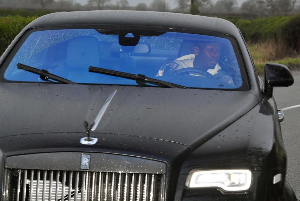  Pogba approached the United training complex in the rain as they get set to make the trip to Turf Moor to face Burnley