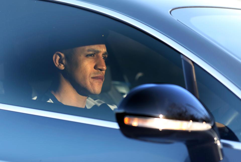  Alexis Sanchez looks glum as he arrives for training today