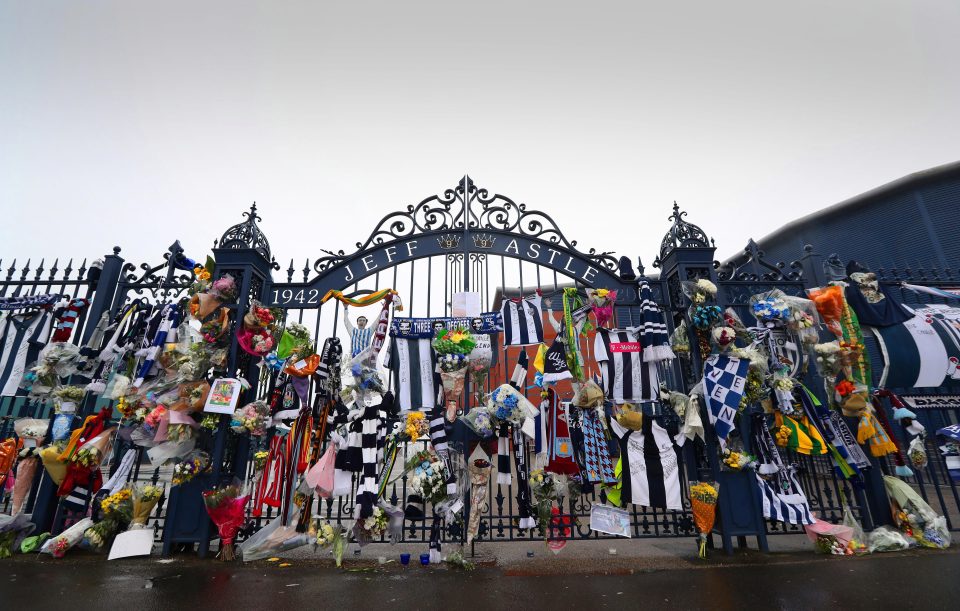  Flowers, scarves and shirts were left at the Jeff Astle gates