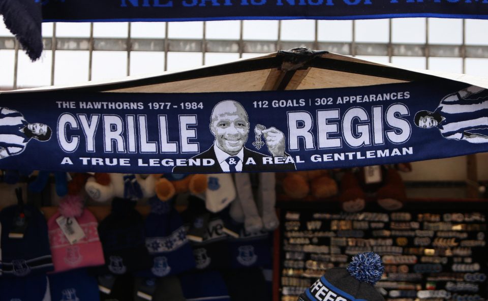  Fans at Goodison Park hold up a scarf for the Baggies veteran