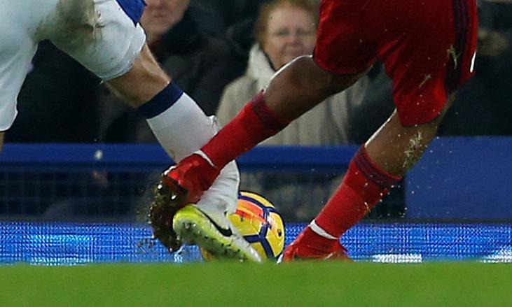 The leg of James McCarthy crumples under the challenge of Rondon