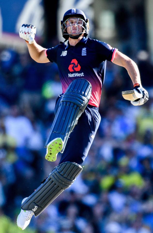  Jos Buttler celebrates reaching his hundred off the last ball of the innings