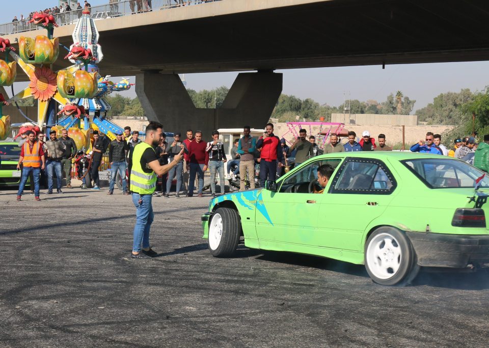  The tricked-out drift cars tear around daredevil spectators creating loud  exhaust bangs