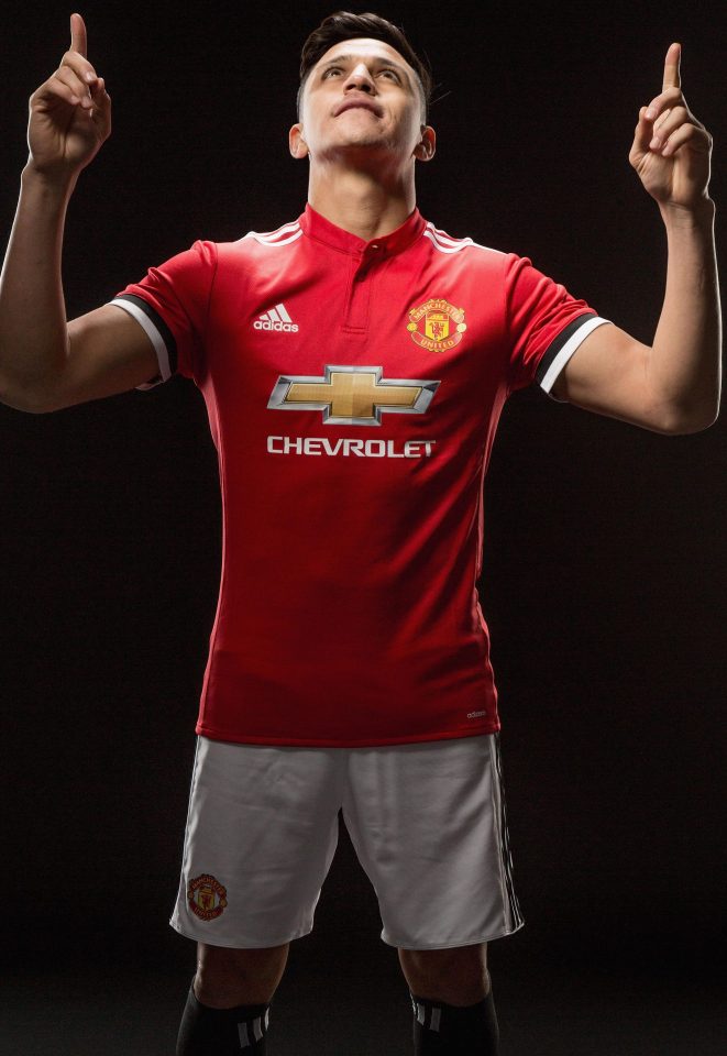  Alexis Sanchez looks delighted to be in United colours and he would do on £600,000-a-week