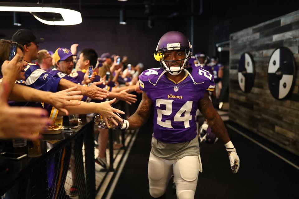  Players walk through one of the exclusive bars to make their way to the field