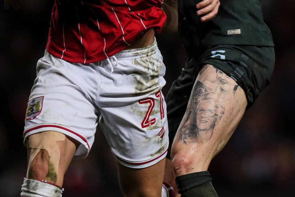  John Stones' tattoos are surrounded by an incomplete rose design