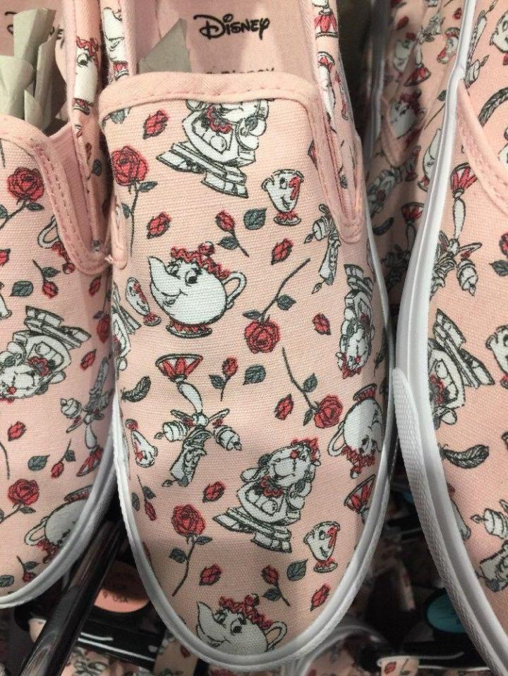  The pink slip-ons, which are available to buy now, also feature a pretty red rose pattern