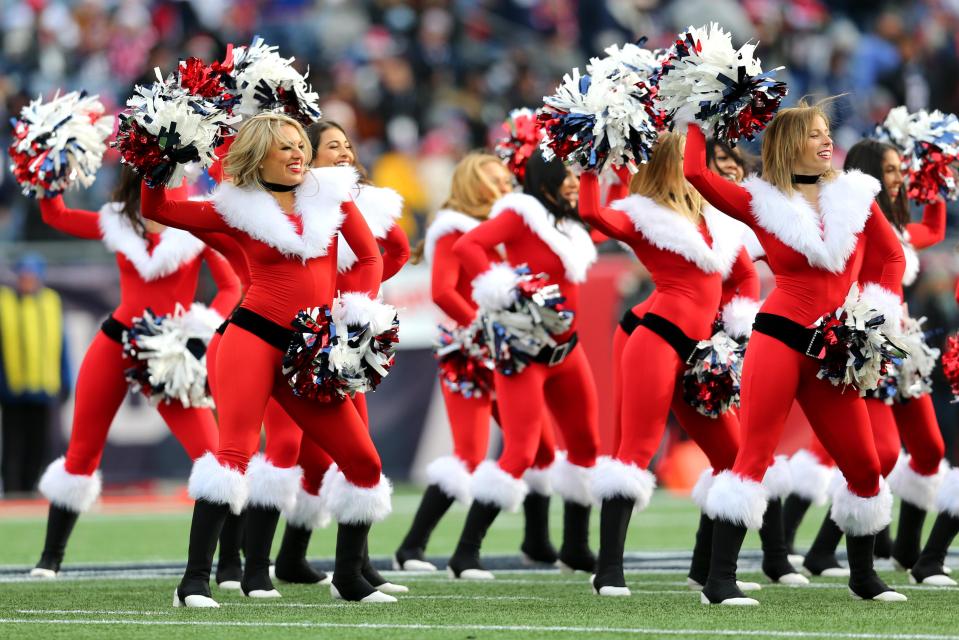  Patriots cheerleaders dressed up in Christmas outfits