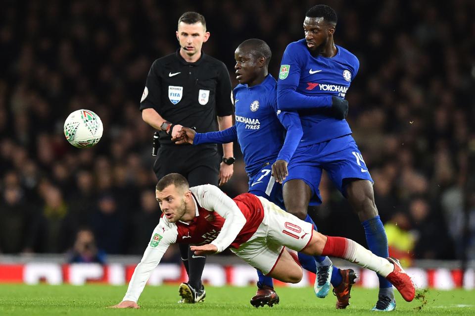  Wilshere wins a header up against Chelsea's midfield in the 2-1 win