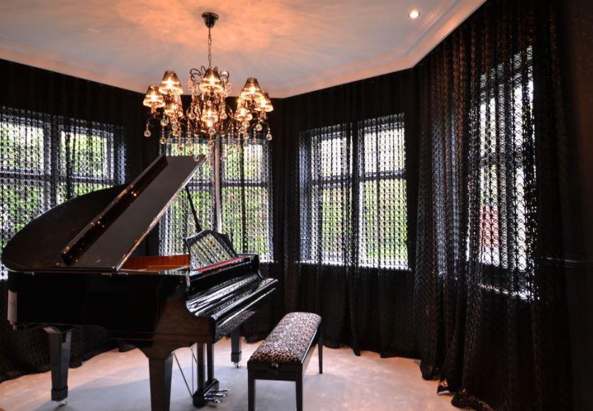  Included in the £2m mansion is a piano room - perfect for Alexis Sanchez