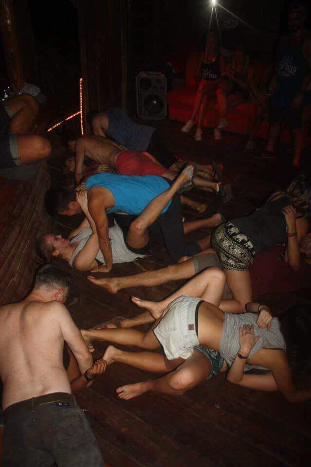  The photographs were taken at a party and appear to show clothed tourists simulating sex positions