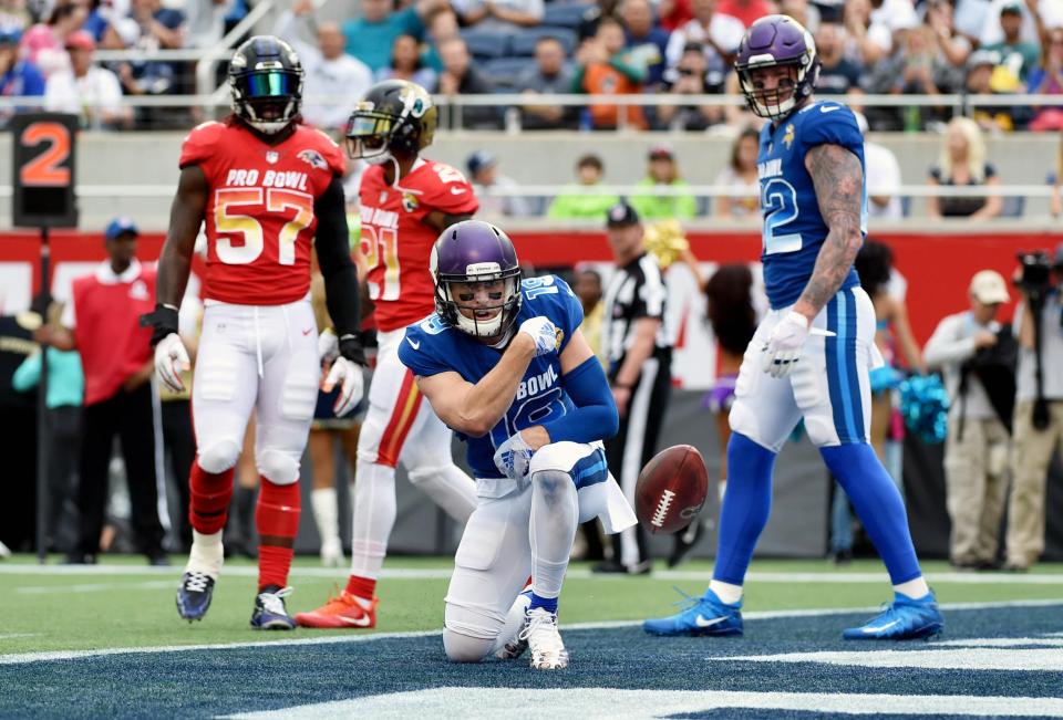  Adam Thielen celebrates his touchdown in a strong start for the NFC team