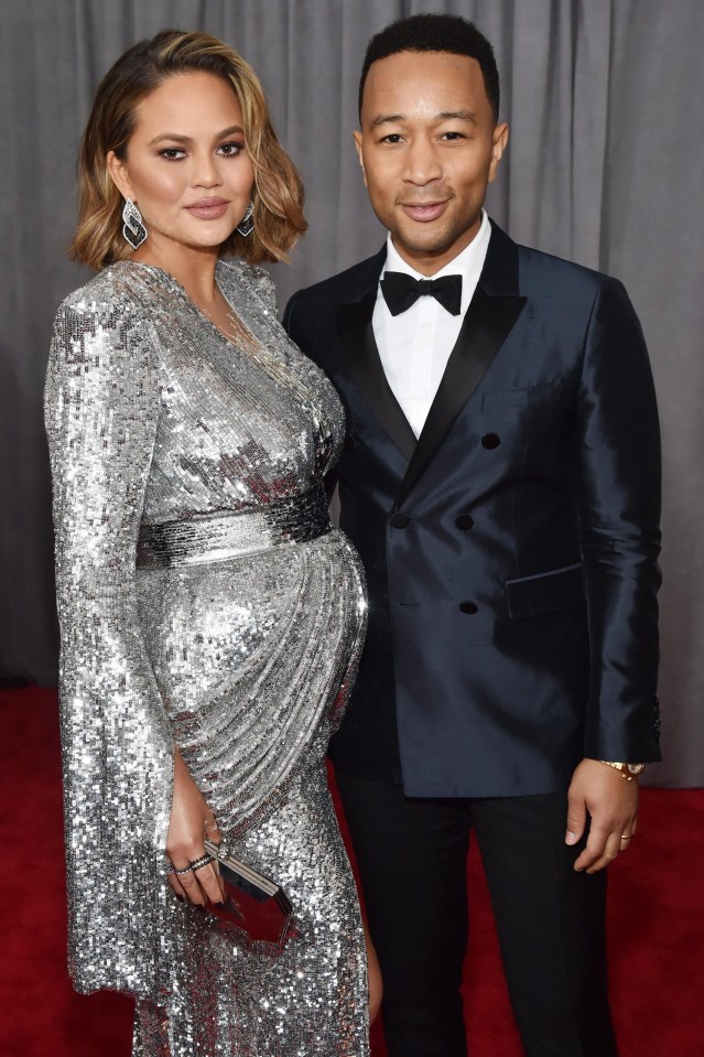 Her husband John Legend cut a dashing figure as he posed alongside her