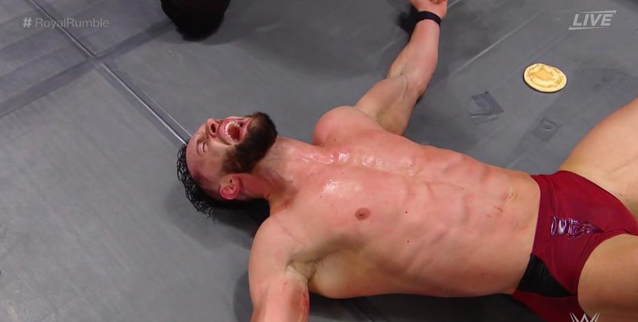  Finn Balor was sent sprawling out of the ring by John Cena, to boos from the crowd