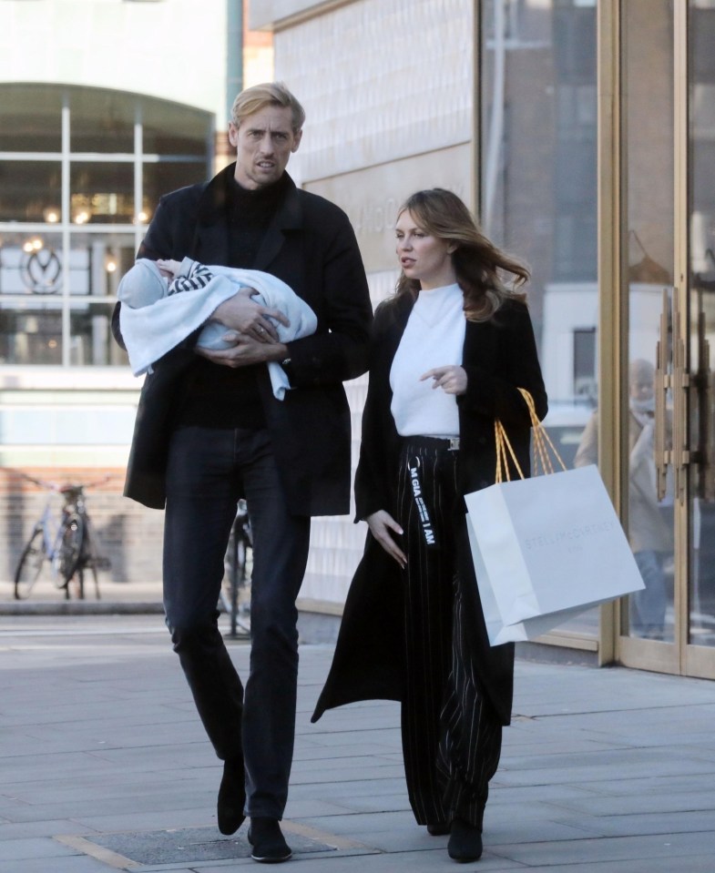 Peter Crouch was the doting dad during a day out with Abbey Clancy and their newborn baby son