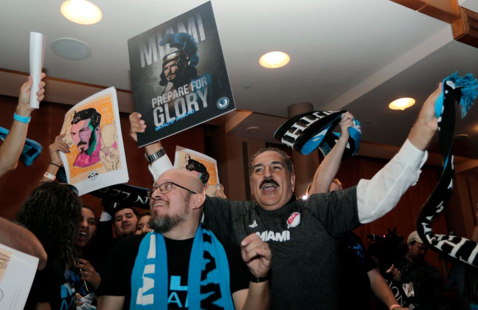  Miami fans celebrate after their city was granted an MLS team