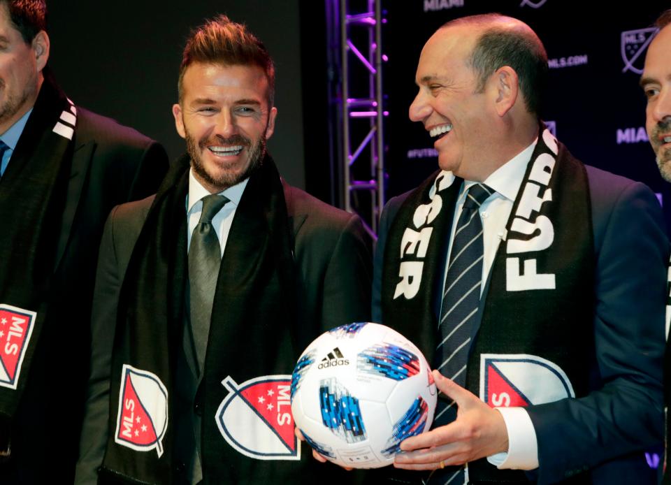  Beckham with Major League Soccer Commissioner Don Garber