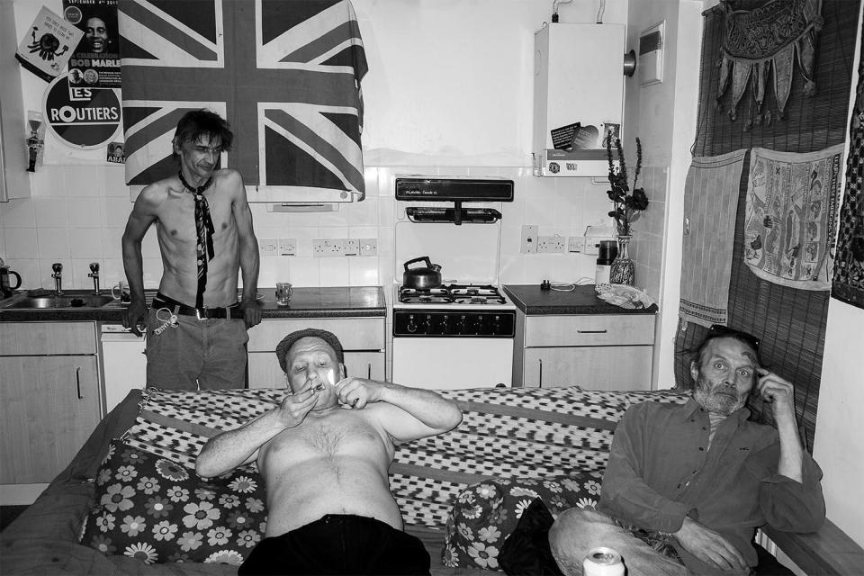  Musicians Rupert, (left) and Joe (right) live with a friend (centre) in a council house in Kilburn, north London