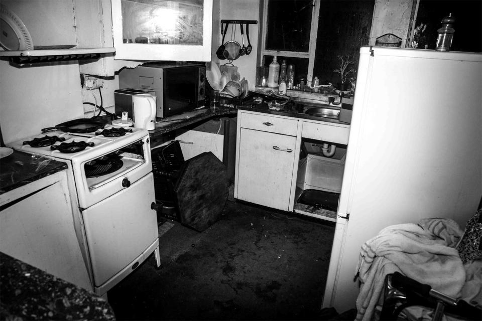  The kitchen in Andy and Sheila's home is encrusted in filth and grime