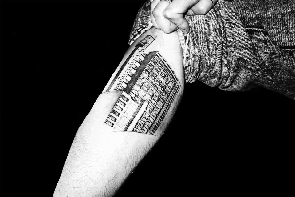  One drug user shows off an intricate tattoo of the celebrated Trellick Tower in Kensal Green, London