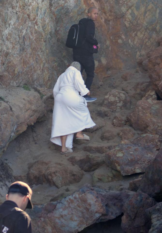  She wrapped up in an enormous dressing gown and walked back up a cliff once the shoot was over